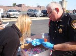 drug-drop-off Marion General Hospital Pharmacy Intern Megan Root checks medication with Deputy Williams to classify a medication that was collected.
