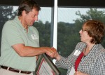 Myra Wilson, Alber Enterprise Center Director, presents award to John Hohn, Director of Economic Development for the Hardin County Chamber of Commerce.