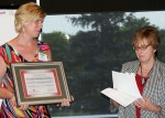 Myra Wilson, Alber Enterprise Center Director, presents award to Stephanie Jolliff, Agricultural Education Teacher & FFA Advisor for Ridgemont Schools.