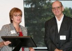 Myra Wilson, Alber Enterprise Center Director, presents award to Raymond Ball, Director of Labor Relations and Resource Services for National Lime & Stone.