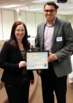 Amy Parsell and Jacob Johnston of Verne Hart Insurance accepted the Community Partner Award at Marion Goodwill's annual meeting.