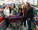 Youth Engaged in Philanthropy members are shown shopping last December for games to stock the Boys and Girls Club's new center.