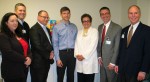 Dr. Kumpf (center) is congratulated by, from left, Dr. Julie Tome, vice president of Medical Affairs, North Region, OhioHealth; Eric Wallis, CNO/vice president, Patient Care, Marion General Hospital; Steve Brown, vice president, Finance, Marion General Hospital; Terri DeTano, vice president, Operations Integration and Quality, Marion General Hospital; David Miller, vice president of Operations, OhioHealth Marion Area Physicians, and Joe Hooper, chief operating officer, Marion General Hospital.