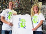 Nick (left) and Chelsea Sims Van Meter show off the Free T-shirts being given away at all Sims Brothers Recycling locations.