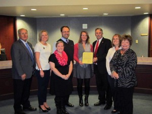 Josh and Heather Tackett, along with Marion County Children Services’ staff, accept a proclamation from the Marion County Commissioners.