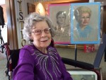 June at 102 years old with 2 of her paintings.
