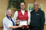 Modern Woodmen of America Representatives Kathie Seckel and Roger Ruth present Hometown Hero Award to Kenny Spafford (center).