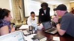 Lean Six Sigma Master Black Belt Norma Simons (standing), a solutions partner with OSU Marion’s Alber Enterprise Center, discusses impact improvements regarding facility use with Marion City Schools staff members (l-r) Jennifer Ratliff, Stephen Fujii, and Brian Mitchell. They are one of four MCS teams learning how to implement the Lean Six Sigma problem-solving process – traditionally used in business and industry – to provide measurable bottom line improvements throughout the district.