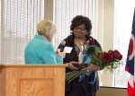 Arnita Pittman (right), Executive Director and Founder of the Arnita Pittman Community Recovery Center, receiving the 2016 ATHENA trophy from Diane Glassmeyer.