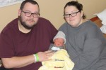 Parents, Jeffrey and Ashely Osborne with the first baby of the new year in Marion county, Preston.