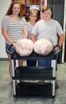Hannah and Colton Brush presenting the processed turkeys to Judy Kuchar (center), kitchen volunteer at the Marion Senior Center.