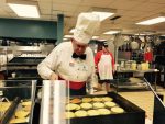 Kiwanis member Jack Bull working the pancake grill.