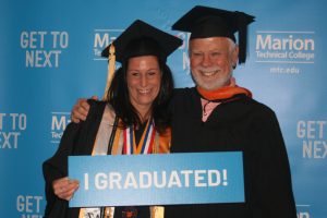 graduate Amanda Sivey with her father, MTC Engineering Professor Russ Sivey, at graduation.
