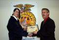 Chuck Yoder presents the AgCredit 110% award to Brandon Parks. The award is presented to the member who are always working, often behind the scenes, to get the work of the Chapter done. Parks participated in just about every activity related to FFA and was instrumental in planning many of them as well.